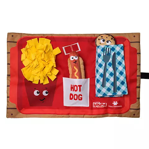The Nina Ottosson Snuffle Activity Puzzle Mat by Nina Ottosson features a playful fast-food theme—cartoon fries, hot dog, cookie, utensils, and blue checkered napkin—making it a perfect interactive foraging toy for dogs.