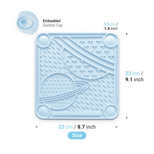 The PAW Planet Lick Pad by Your Whole Dog is a blue silicone placemat with suction cups, featuring a space theme with planets. Its dimensions are 23 cm x 22 cm (9.1 x 8.7 inches), ideal for a mess-free, slow-feeding experience.
