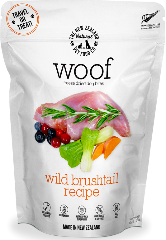 A bag of WOOF Freeze Dried Wild Brushtail Dog Food by WOOF - The NZ Natural Petfood Co, made with grain-free raw meat, berries, and vegetables; product features are shown on the packaging.