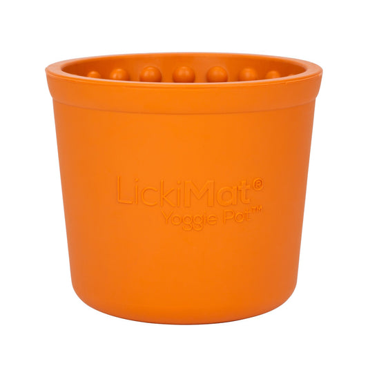 An orange LickiMat: Yoggie Pot Slow Feeder Bowl, potentially a pet enrichment accessory from Your Whole Dog.