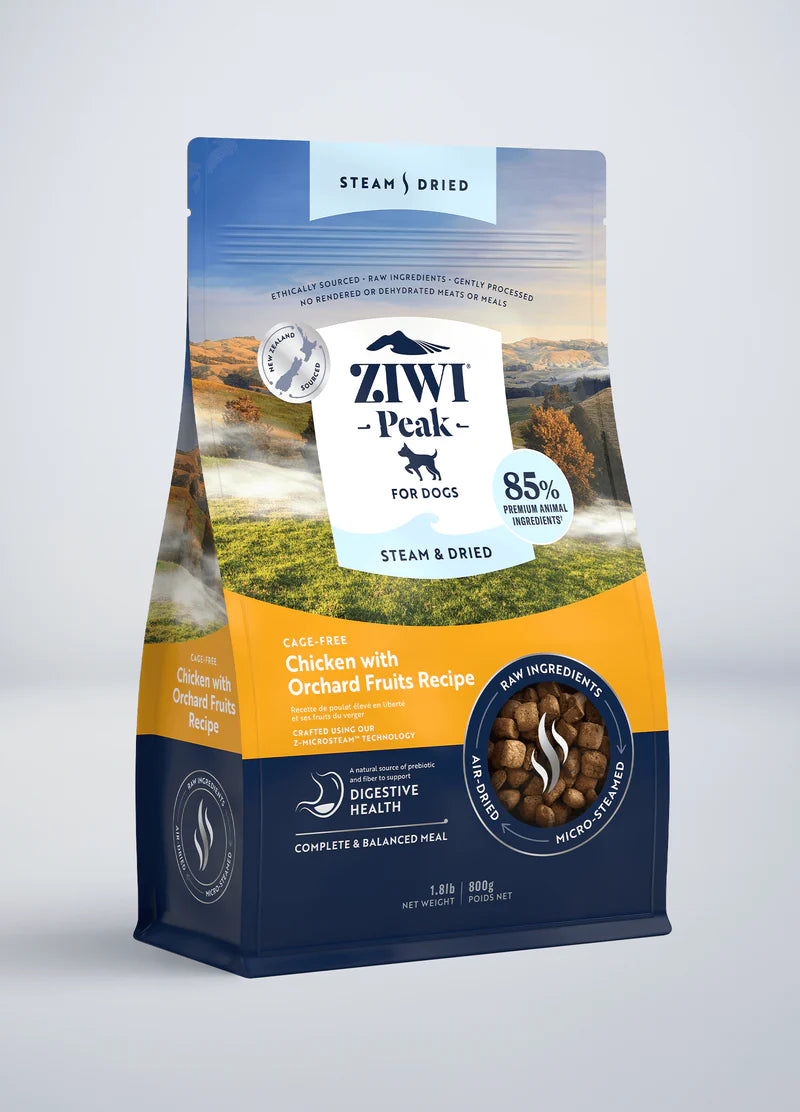 The Ziwi Peak dog food bag features their Steam & Dried Chicken with Orchard Fruits Recipe, with ethically-sourced chicken and 85% meat inclusions. It boasts micro air-dried pieces and highlights digestive health benefits for a complete, balanced pet meal.