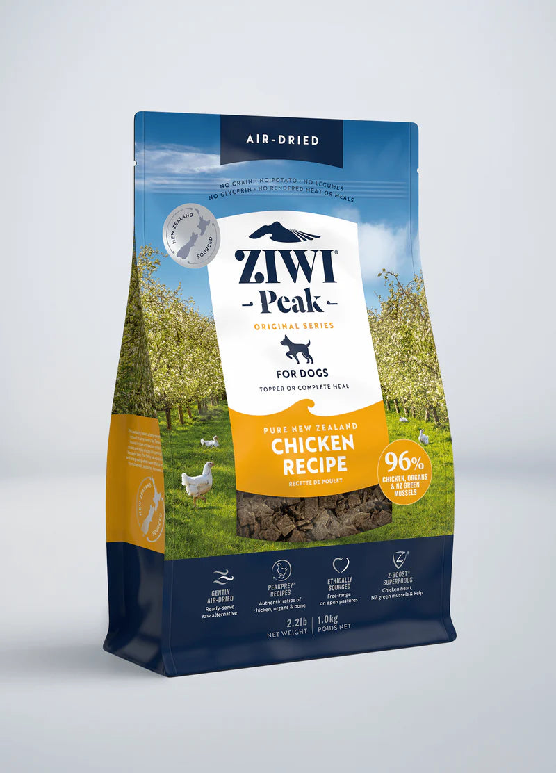 A bag of ZIWI Peak Air-Dried Chicken Recipe for Dogs, highlighting free-range New Zealand chicken, displays a landscape image and product details on the front.