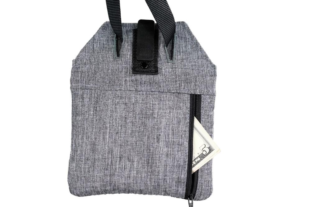 The partially open Blue-9 INSPIRE Training Treat Pouch features gray fabric with black handles and a snap-back closure, revealing folded cash.