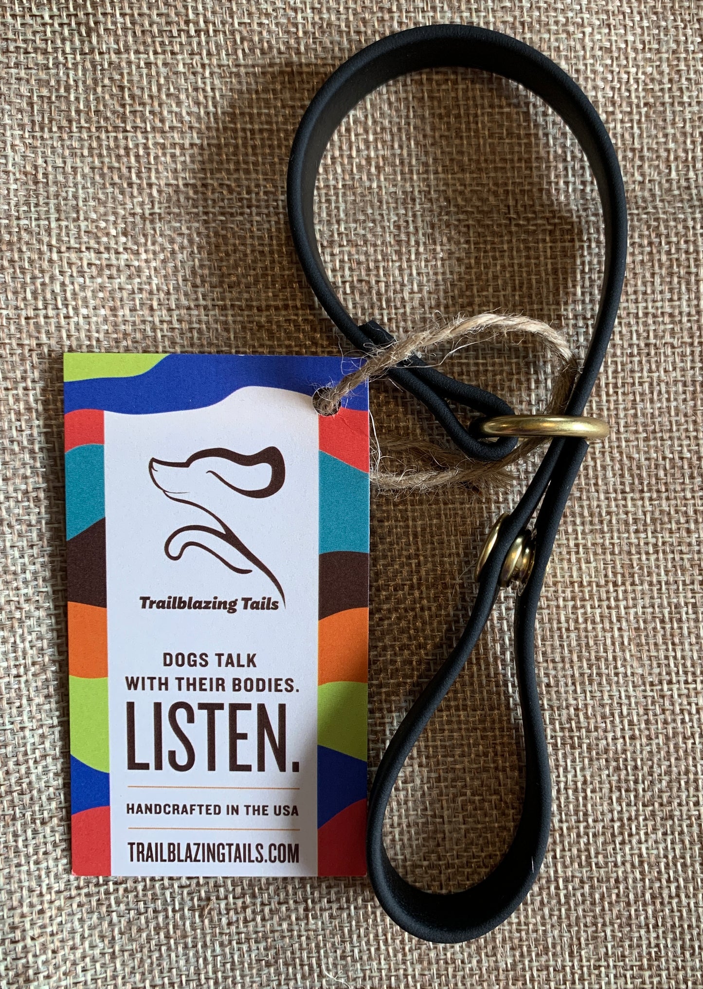 A black dog leash with a cinch snap: The Trailblazing Tails: The Long Line Holder by Your Whole Dog.