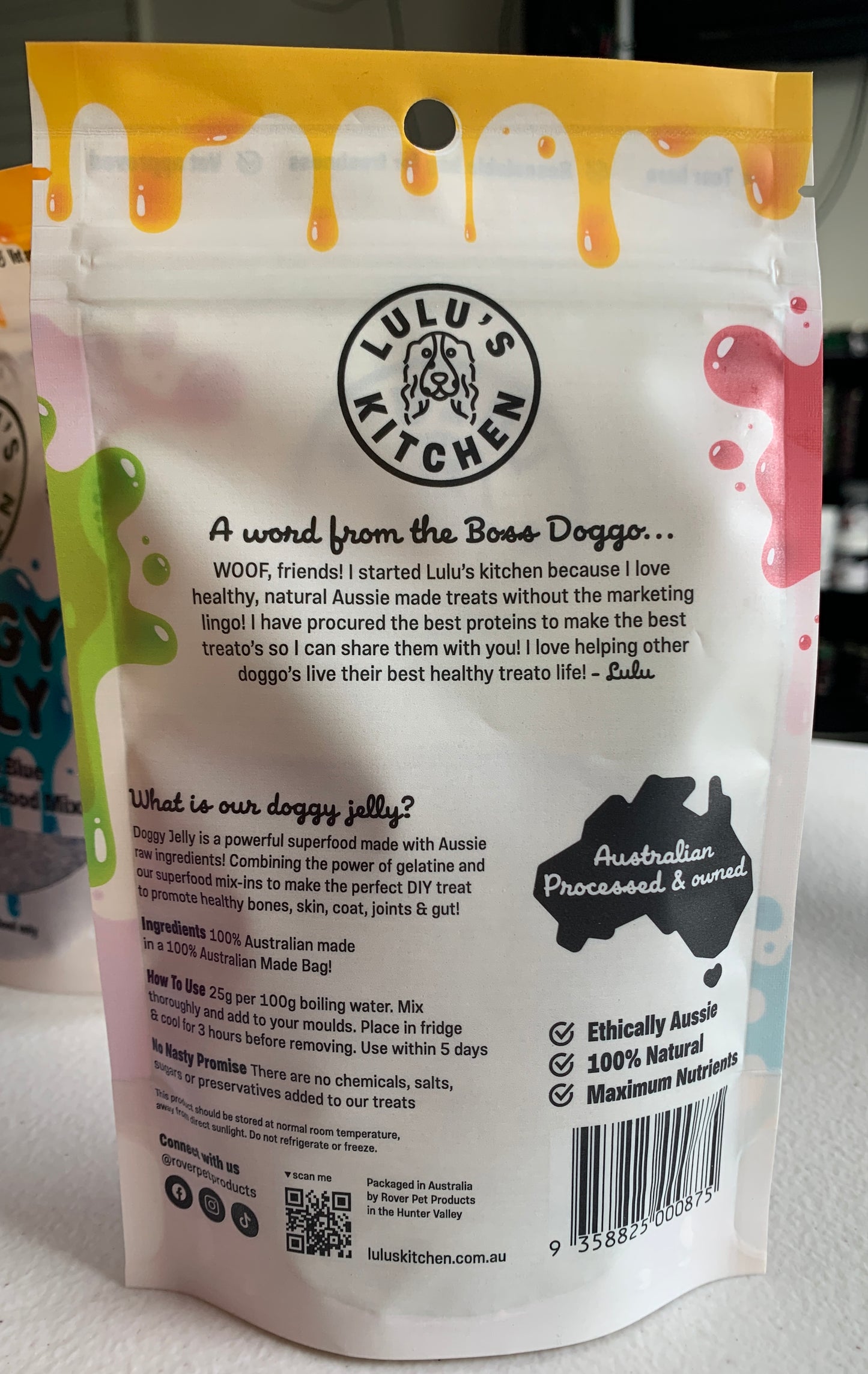 Close-up of Lulu's Kitchen Doggy Jelly - Spinach & Green Spirulina package with colorful design. It highlights natural, ethically sourced ingredients and includes a heartfelt message from the brand owner.