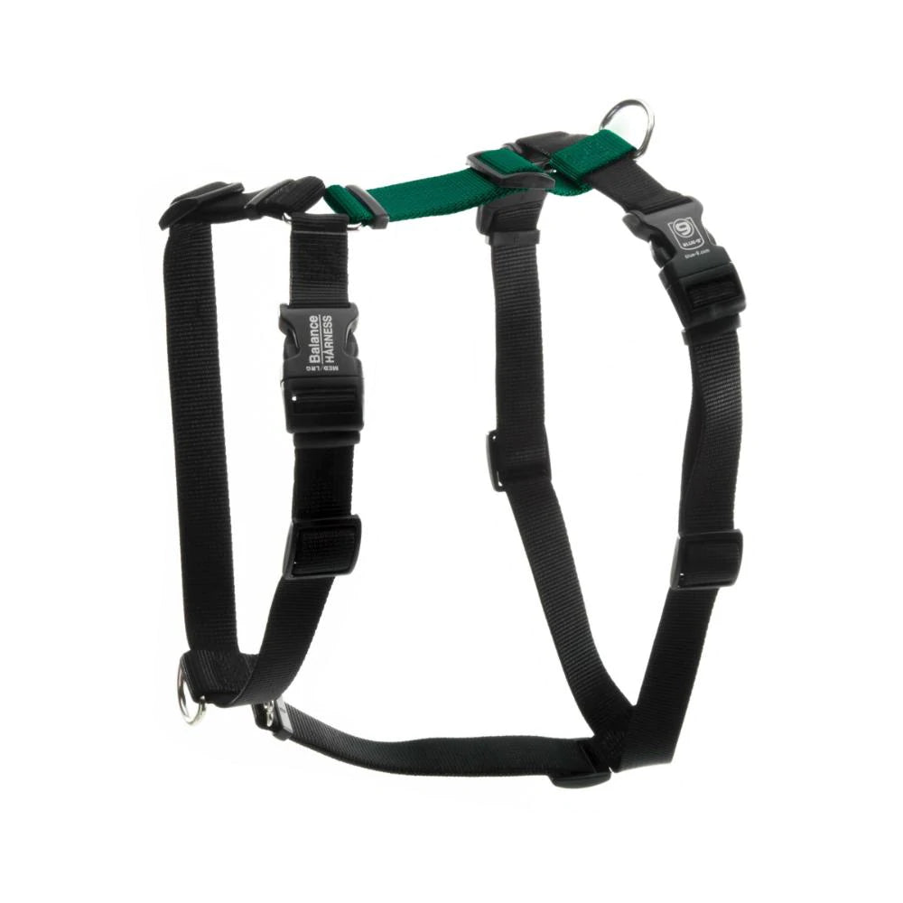 A black and green Blue-9 Balance Harness by Blue-9, featuring metal rings, leash attachment points, and plastic buckle clasps, is laid flat against a white background.