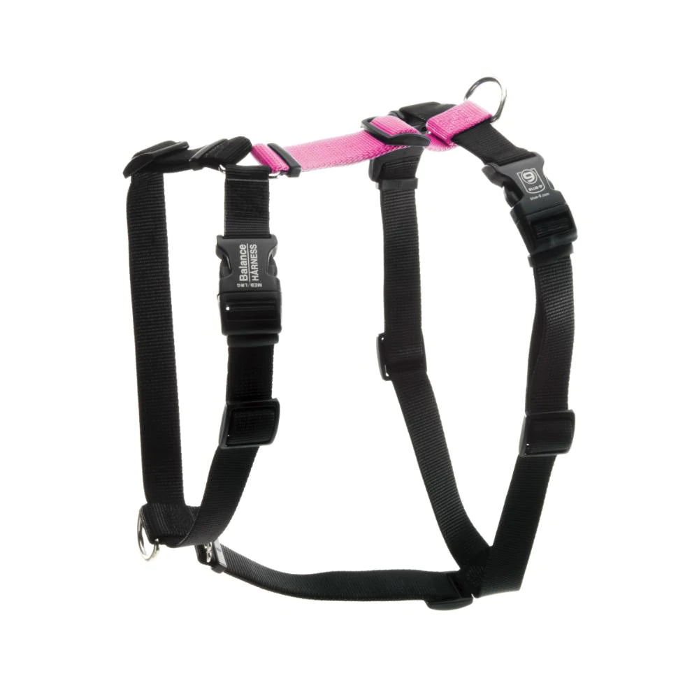 The Blue-9 Balance Harness by Blue-9 is a black and pink adjustable, non-restrictive dog harness with metal rings and plastic buckles for optimal comfort, featuring multiple leash attachment points.
