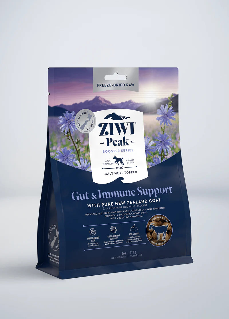 The ZIWI Peak Freeze-Dried Booster - Gut & Immune Support bag features New Zealand goat and stunning mountain scenery with blue flowers, highlighting its innovative role in freeze-dried dog food.