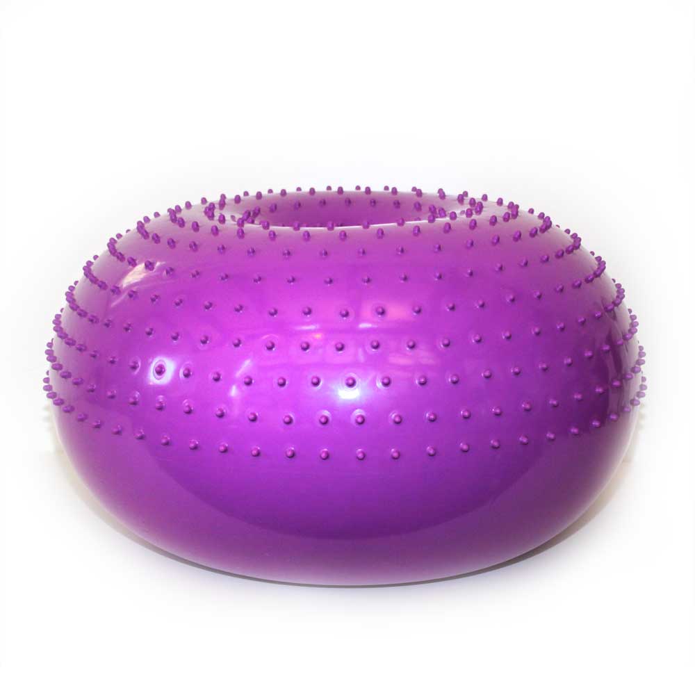 The Flexiness SensiDonut by Your Whole Dog, a purple, donut-shaped exercise ball adorned with small protruding bumps, is perfect for balance training and muscle building. It enhances your workout routine with added sensory stimulation.