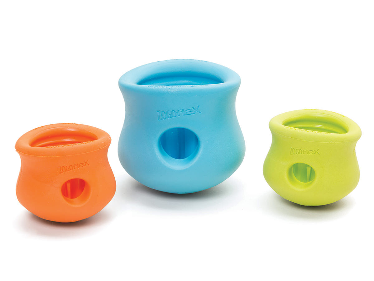 The West Paw Toppl set of three colorful rubber dog toys in orange, blue, and green features durable enrichment toys with a treat-stuffing center hole to engage your furry friend's mind and keep their tail wagging.