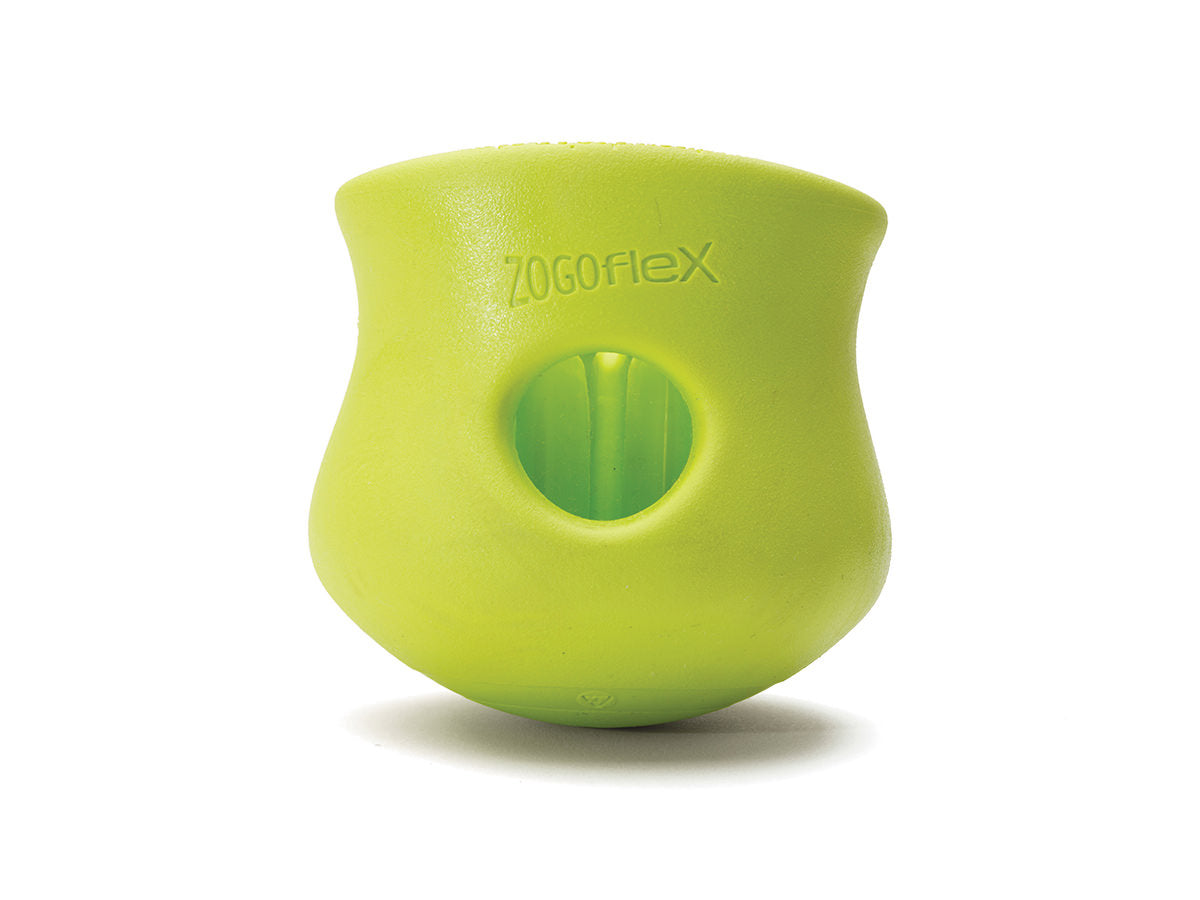 The West Paw Toppl, a durable enrichment toy by West Paw, is lime green, made from Zogoflex rubber, and features a center hole for stuffing food.