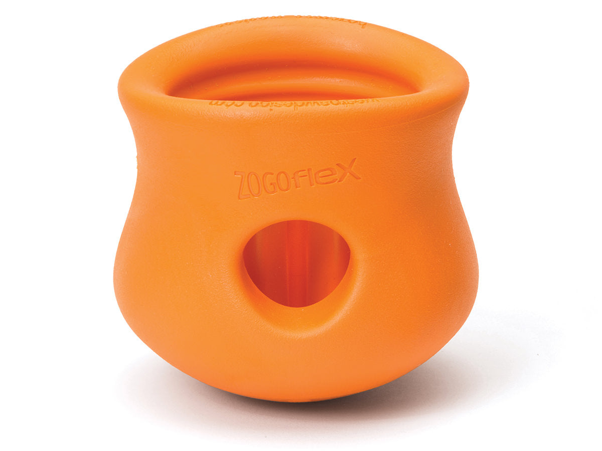 The West Paw Toppl by West Paw is an orange, durable dog toy with a rounded, hollow design and a hole near the base for extra fun.
