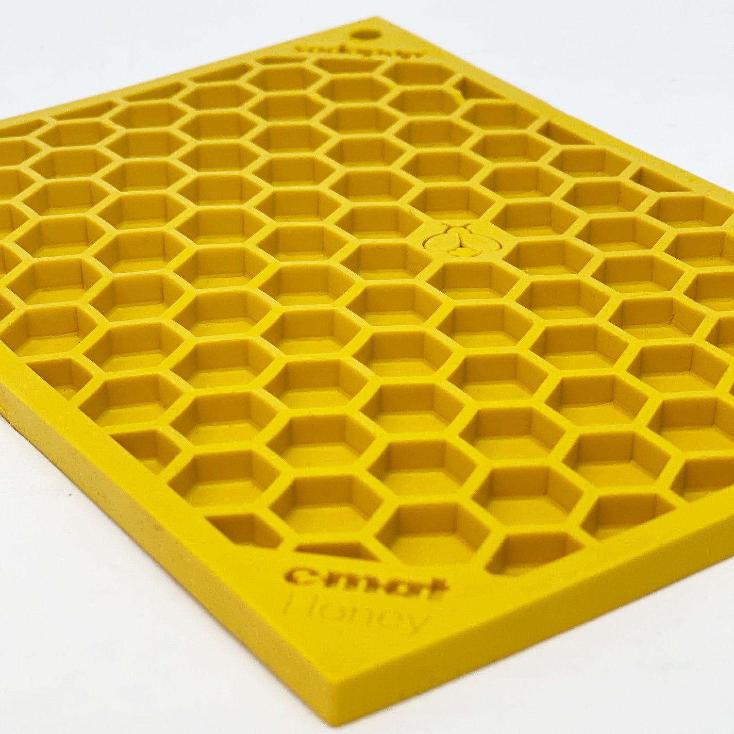 Yellow silicone Your Whole Dog Soda Pup EMAT ENRICHMENT LICKING MAT honeycomb-shaped enrichment mats on a white background.
