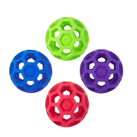 JW Hol-ee Roller by Your Whole Dog offers four vibrant rubber balls in green, blue, purple, and red with a hexagonal cutout design, making them an engaging toy for dogs.