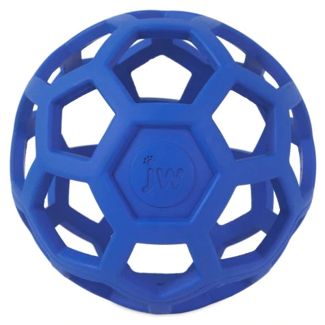 The blue, round JW Hol-ee Roller dog toy from Your Whole Dog features hexagonal openings and "jw" letters on the center panel, and is made of durable rubber.