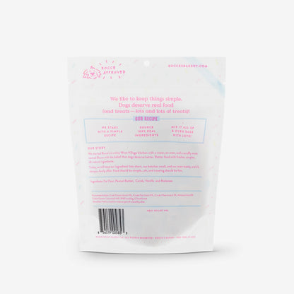 A white plastic bag with pink text, perfect for carrying Bocce's Bakery: Birthday Cake Biscuits (5oz/141g) from Your Whole Dog.