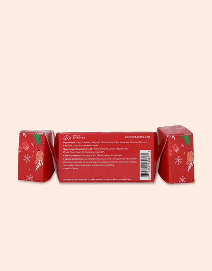 Clearance Bocce's Bakery Winter Roast Christmas Training Bites feature red packaging with white snowflakes and holiday decor. These wheat-free treats, made with chicken and cranberries, are ideal Christmas snacks. Ingredients and barcode visible on one side.