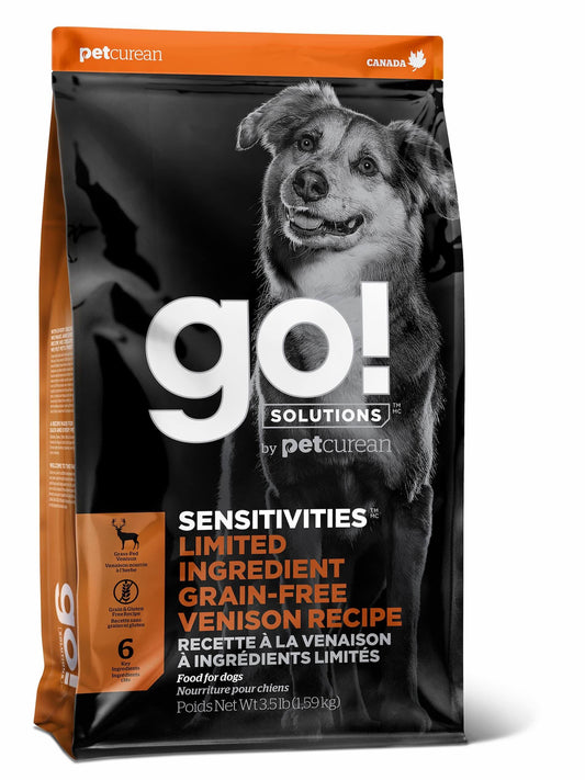 A bag of GO! Solutions SENSITIVITIES Grain Free Limited Ingredient Venison Recipe Dog Food by Go! Solutions, designed for sensitive dogs, with a happy dog and product info in English and French on the packaging.