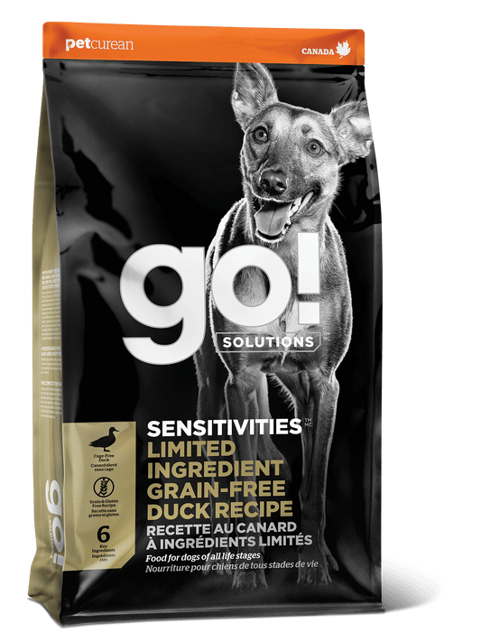 Bag of Go! Solutions SENSITIVITIES Grain Free Limited Ingredient Duck Recipe Dog Food by Go! Solutions, ideal for dogs with sensitivities, featuring a happy dog and detailed product info on the packaging.