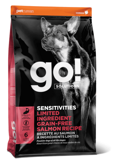 A bag of Go! Solutions SENSITIVITIES Grain Free Limited Ingredient Salmon Recipe Dog Food showcases a large dog image and product details on the front, ideal for dogs with sensitivities.