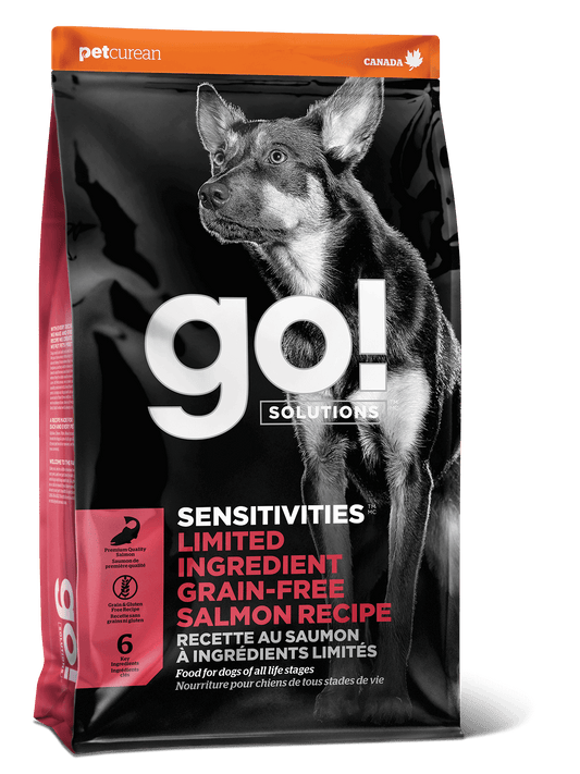 A bag of Go! Solutions SENSITIVITIES Grain Free Limited Ingredient Salmon Recipe Dog Food showcases a large dog image and product details on the front, ideal for dogs with sensitivities.
