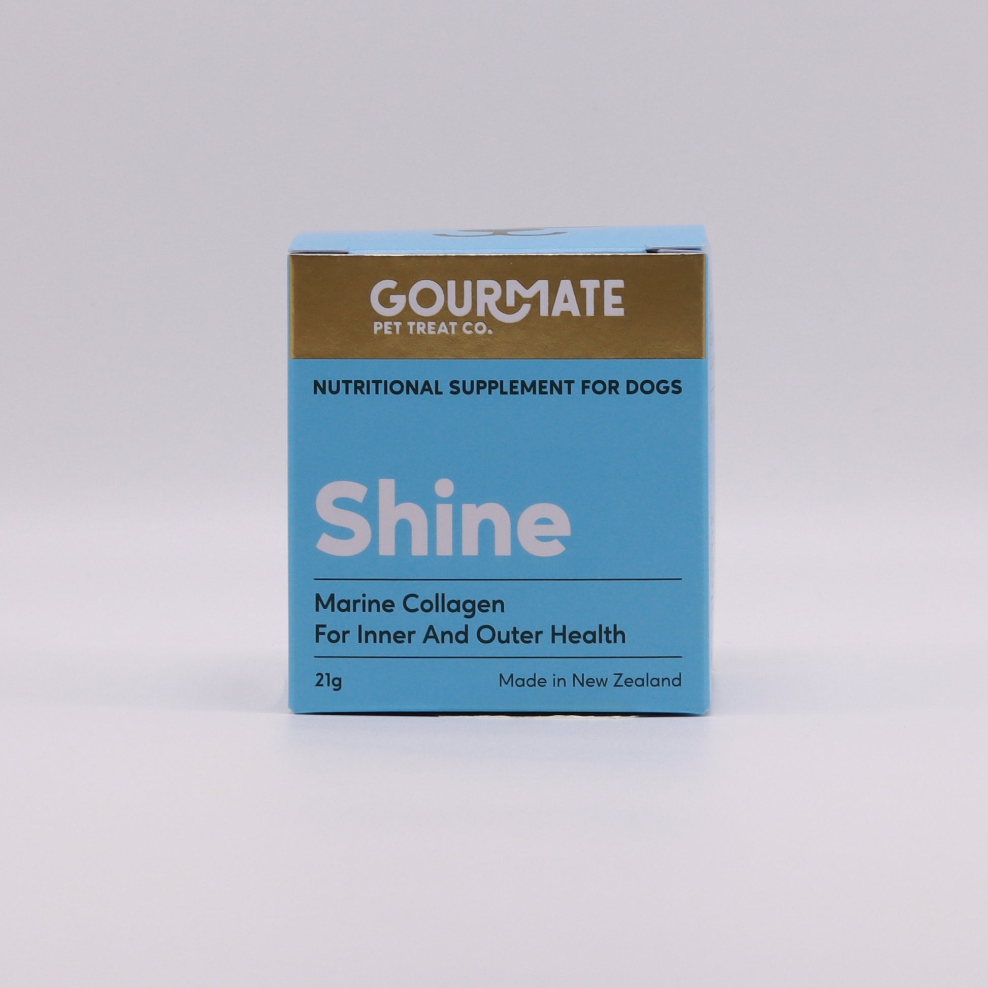 Blue and gold box of "Your Whole Dog" Gourmate Pet Treat Co. Shine Marine Collagen For Inner And Outer Health, enriched with Green Lipped Mussel Oil to support pet joint health. This nutritional supplement for dogs is made in New Zealand and is available in a 21g package.