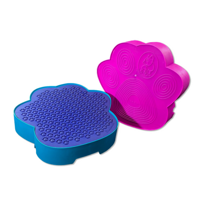 A pink and blue Flexiness PawStep dog paw shaped bowl for dogs by Your Whole Dog.