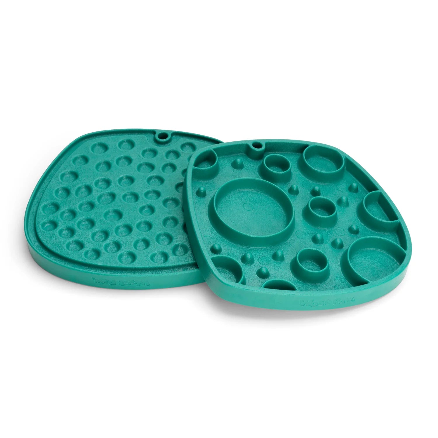 Two green West Paw Feast Mats by Your Whole Dog double as handy slow feeders and lick mats for pets.