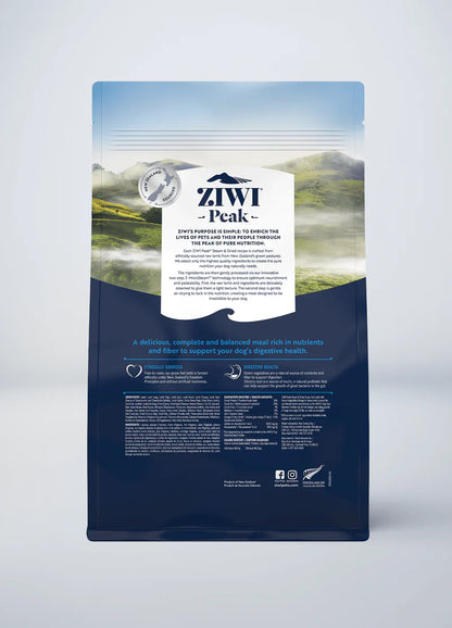 Dog food packaging featuring air-dried raw lamb from ZIWI Peak: Steam & Dried Lamb with Green Vegetables Recipe with a tranquil landscape background on top and detailed nutritional information on the lower blue section.