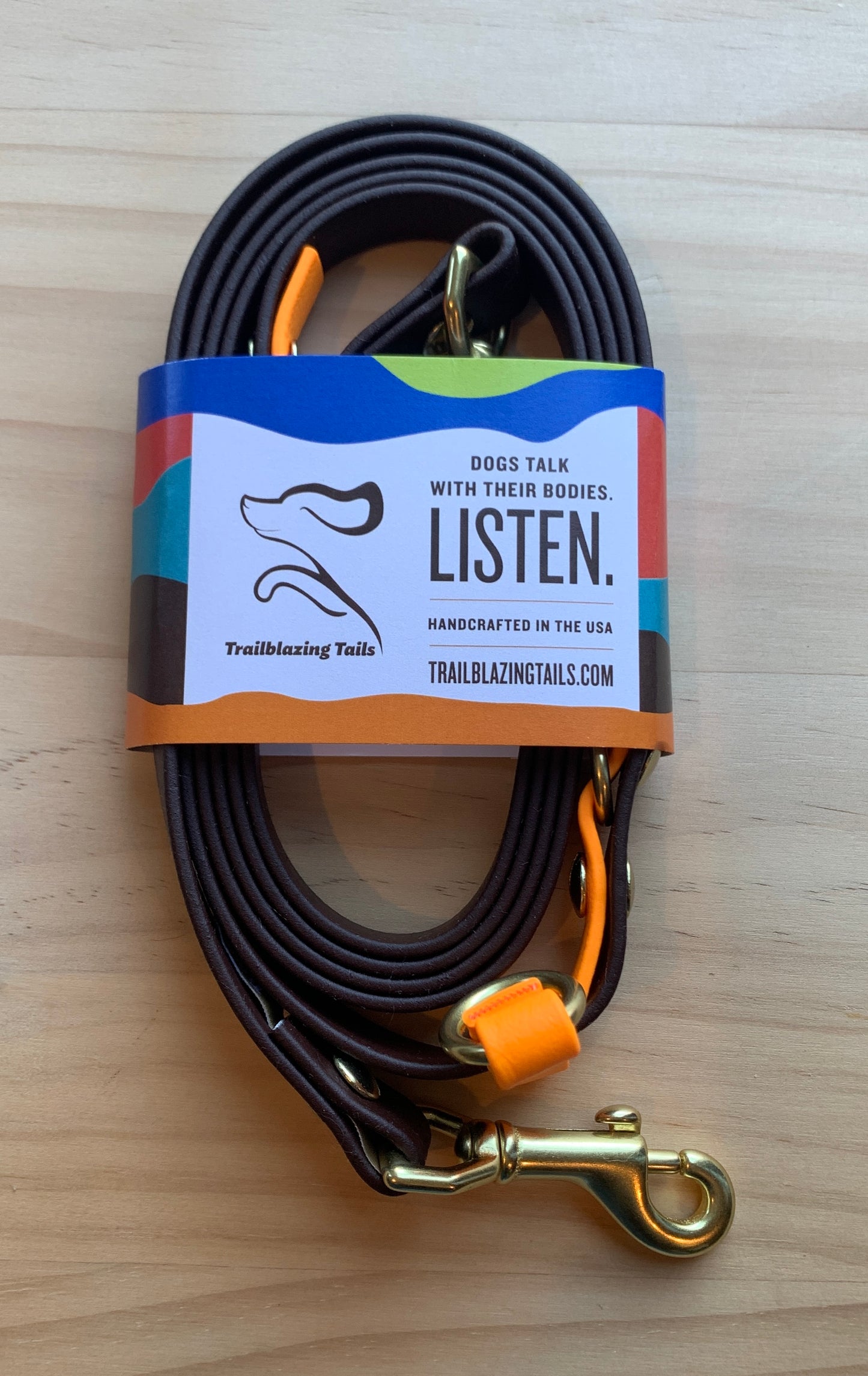 A Trailblazing Tails: The Sunny dog leash with an adjustable length that features a tag saying "listen. (current stock) by Your Whole Dog.