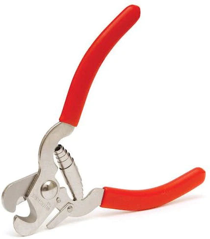 A pair of Millers Forge: Red-Handled Nail Clippers by Your Whole Dog on a white background.