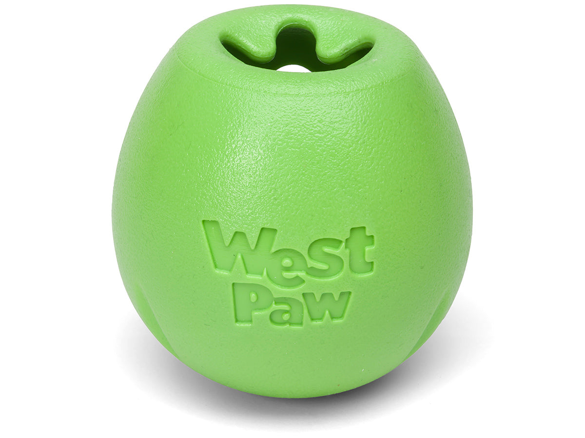 A green West Paw: Rumbl treat-dispensing dog toy with the word Your Whole Dog on it.
