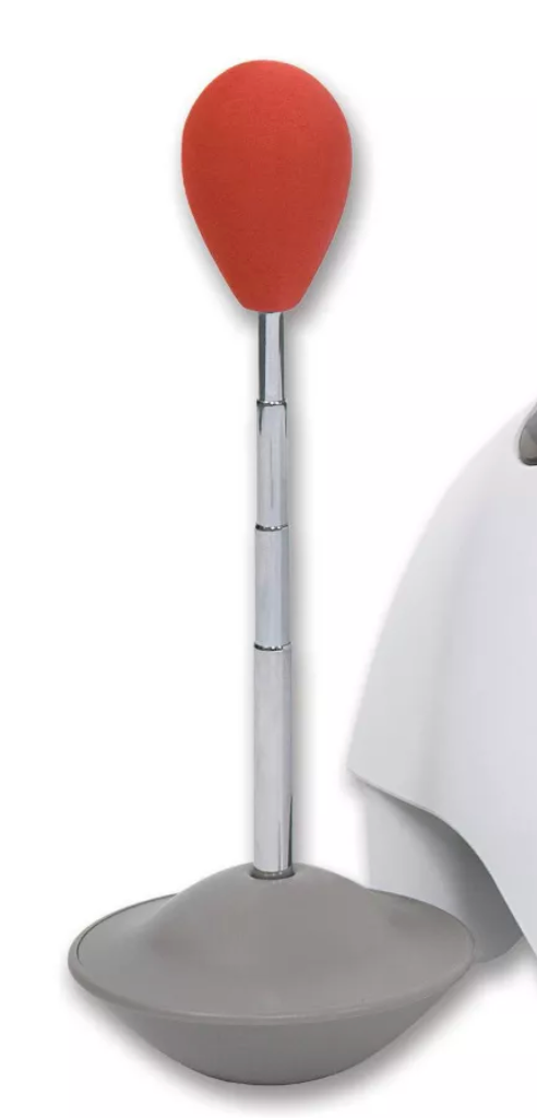 A grey and orange chair with a red ball on top, equipped with the Treat & Train (Manners Minder) Target Stick from Your Whole Dog.