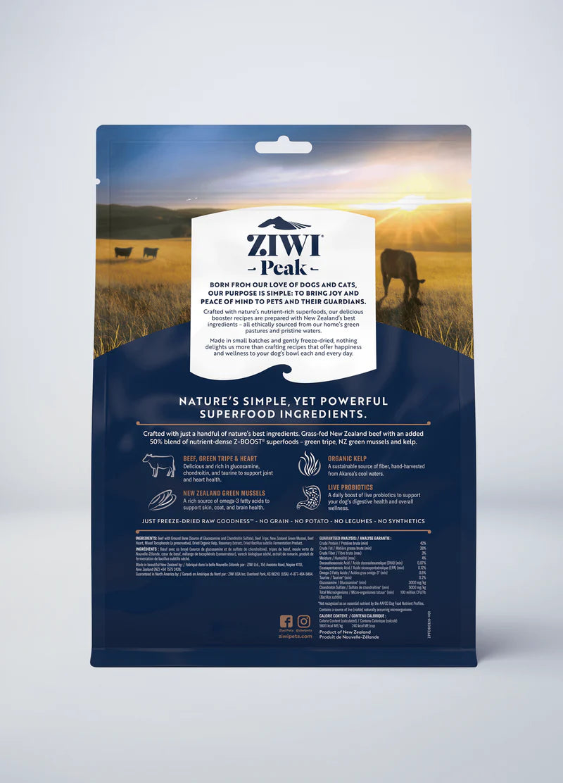 The ZIWI Peak Freeze-Dried Raw Superboost Beef package showcases a pastoral field with grazing animals, highlighting natural ingredients such as organic kelp and New Zealand green mussels for a wholesome diet.