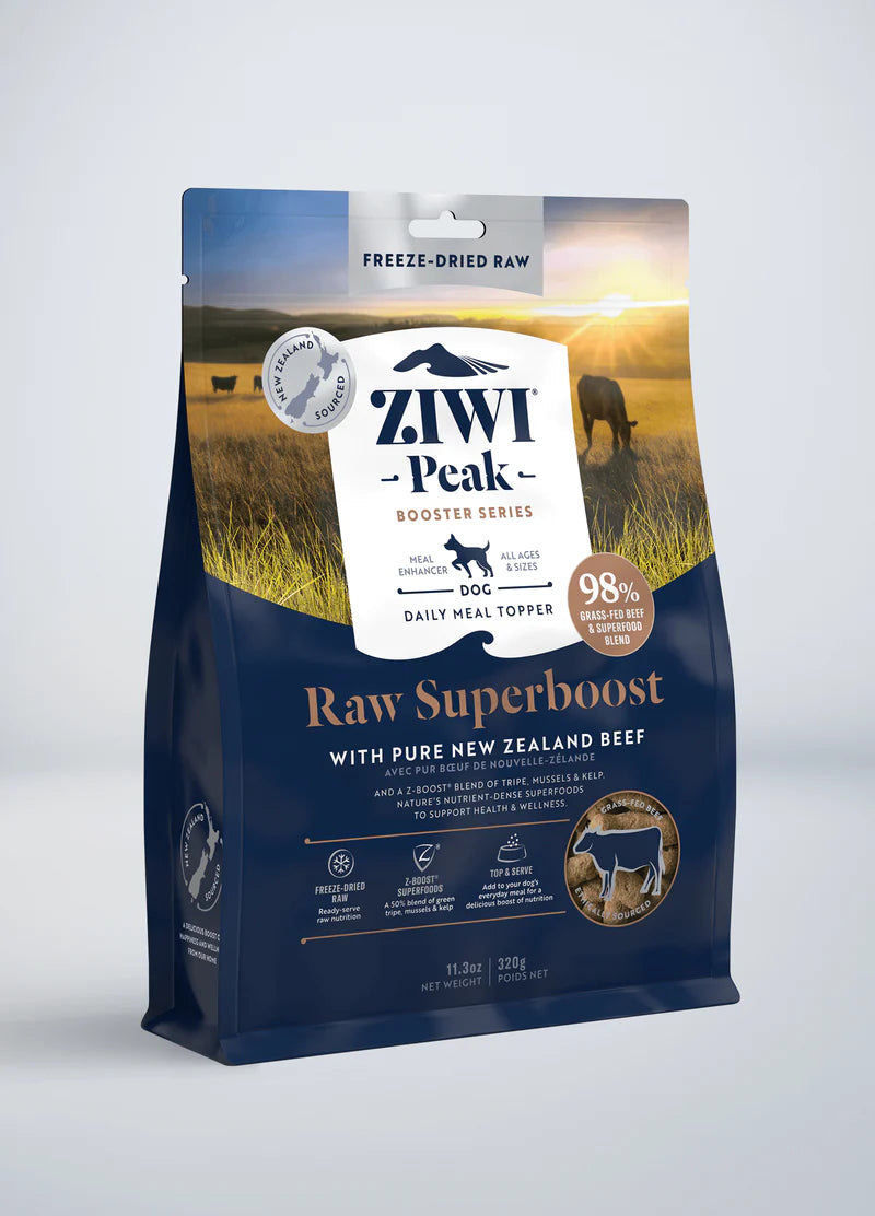A ZIWI Peak Freeze-Dried Raw Superboost Beef dog food bag from Ziwi Peak, featuring New Zealand beef and organic kelp. It boasts 98% air-dried nutrition and meal topper benefits, with packaging showcasing cows and grassland to emphasize its wholesome elements.