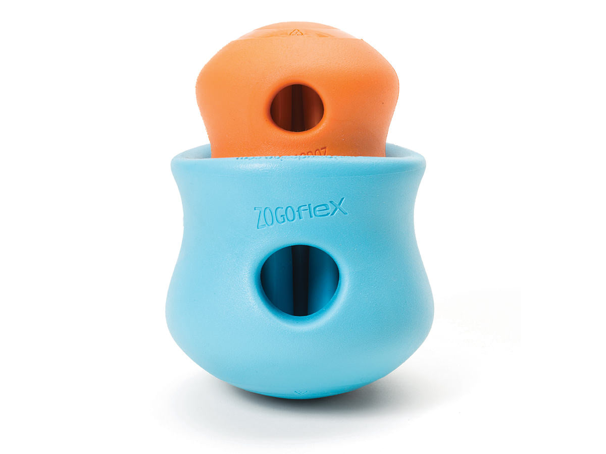 A small orange and large blue West Paw Toppl dog toy on a white background.