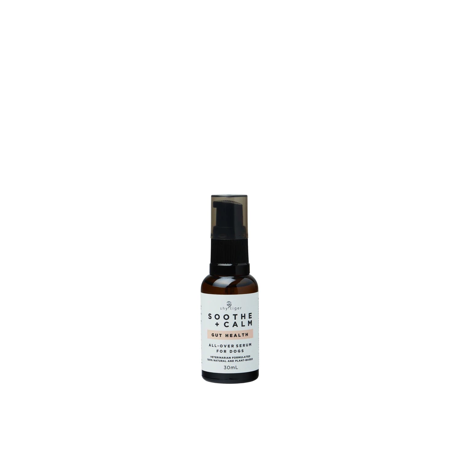A small brown bottle of "Shy Tiger Soothe + Calm GUT HEALTH Serum" from Your Whole Dog, infused with essential oils, features a black pump top and is labeled as a dog supplement.