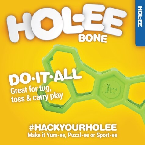 A colorful advertisement for the CLEARANCE: JW: Hol-ee Bone dog toy by Your Whole Dog, crafted from natural rubber, promoting its versatility for play.