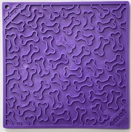 A purple silicone Your Whole Dog Soda Pup EMAT ENRICHMENT LICKING MAT with a bone pattern and the words "lick me.