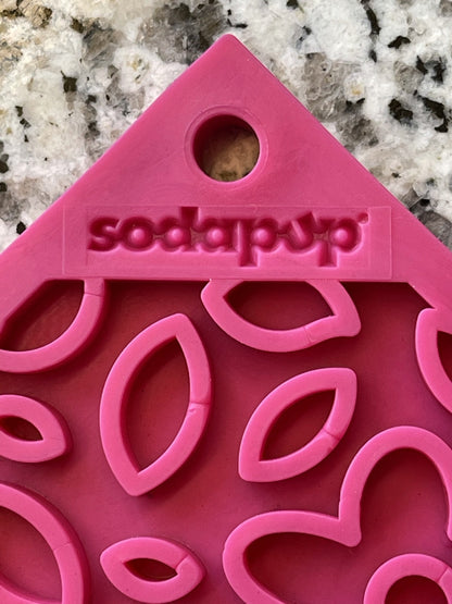 A pink Your Whole Dog Soda Pup cookie cutter.