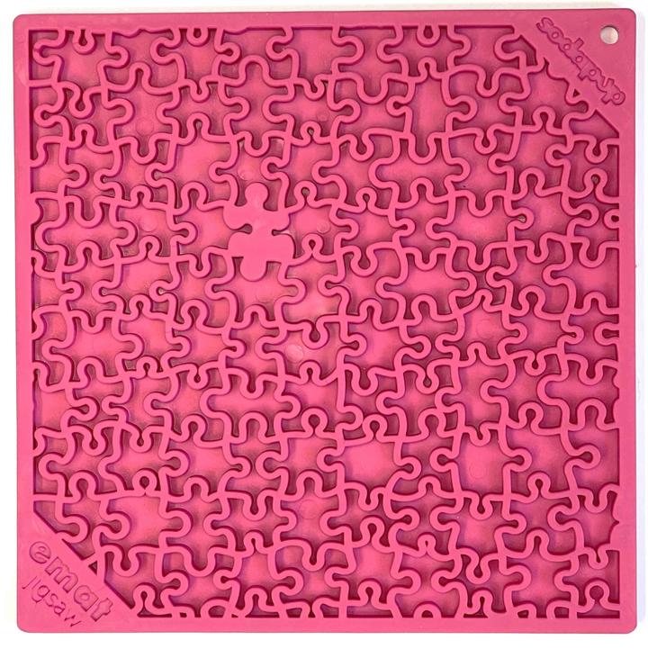 A pink Your Whole Dog Soda Pup EMAT ENRICHMENT LICKING MAT jigsaw puzzle with one piece missing.