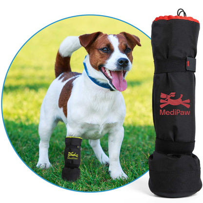 A dog is standing in front of a bag with a Your Whole Dog MediPaw: Soft Bandage (Basic) Boot item on it.