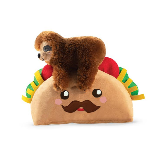 A sleepy sloth on top of a CLEARANCE: Fringe Studio TACO SLOTH Plush Squeaker Dog Toy by Your Whole Dog.